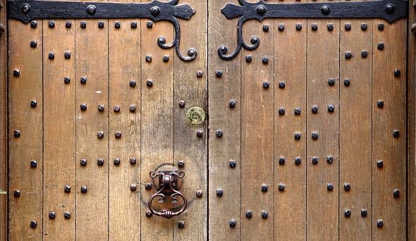 Old wooden door with ornate handle